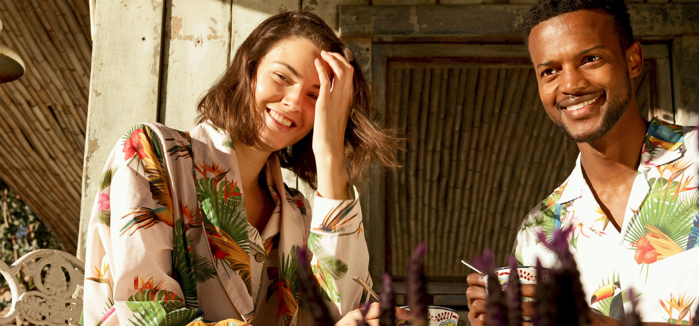 Romantic couple enjoying breakfast wearing Woodstock Laundry garments